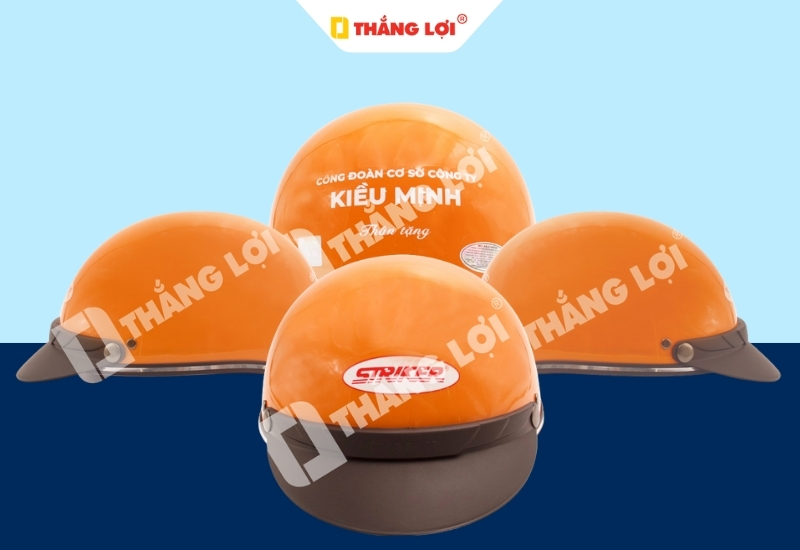 Nón bảo hiểm nửa đầu màu cam in logo công ty Kiều Minh